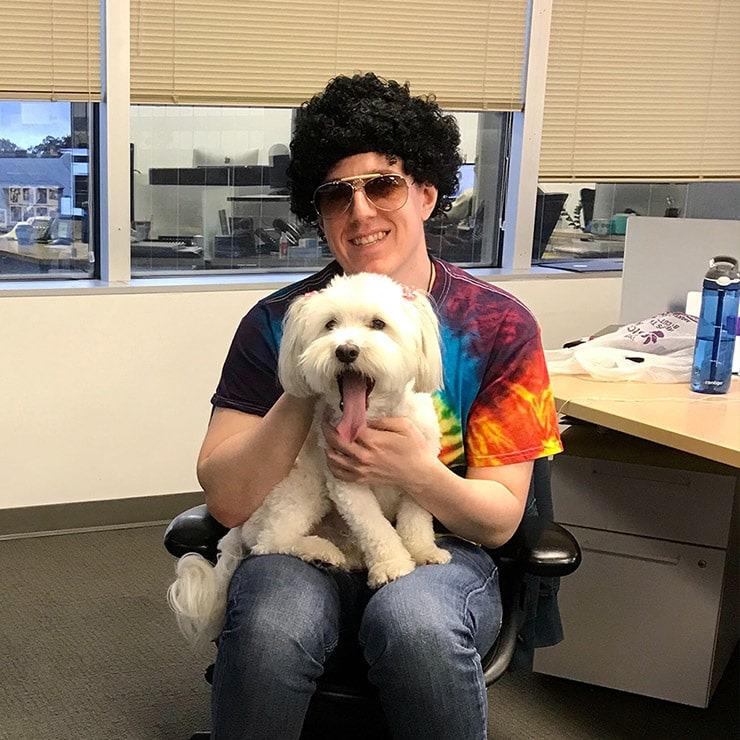employee with dog on Halloween