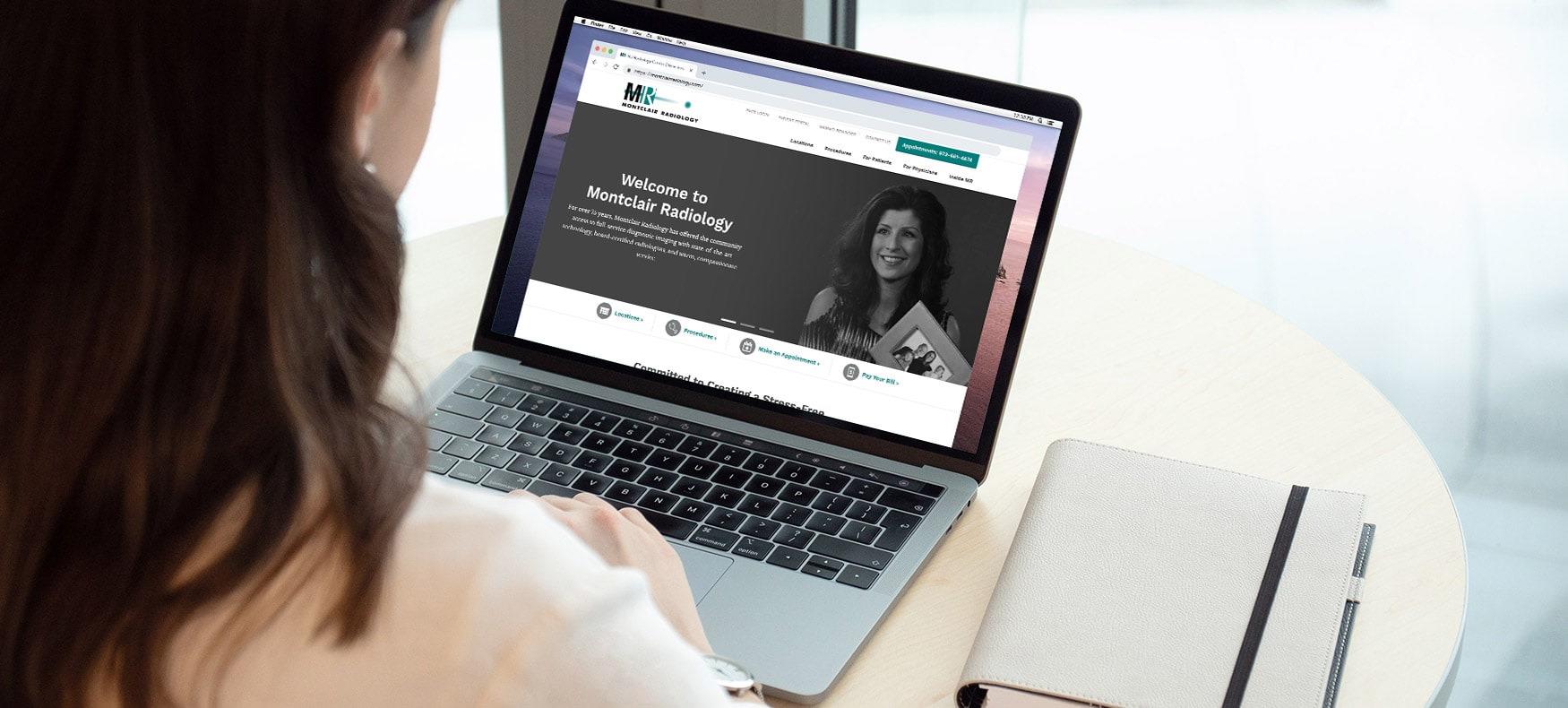 woman browsing Montclair Radiology website on laptop